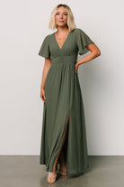 Full-length shot of Ramona Maxi Dress in dark sage, emphasizing empire ruching, smocked back, and inclusive sizing range.