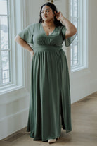 Side view of Ramona Maxi Dress in dark sage displaying the left leg slit, flowing skirt, and flattering silhouette.