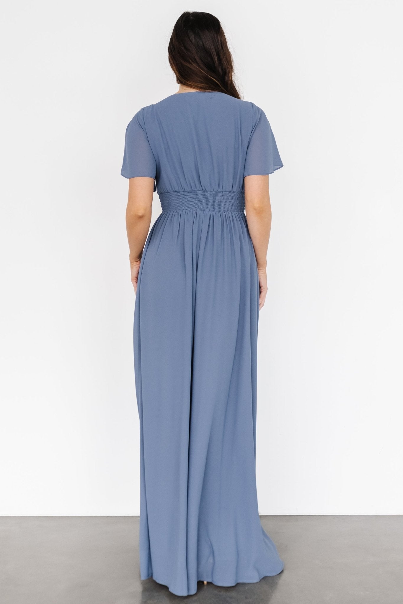 Full-length studio shot of the chiffon maxi on model, showing soft hemline, V-neck and overall elegant silhouette.