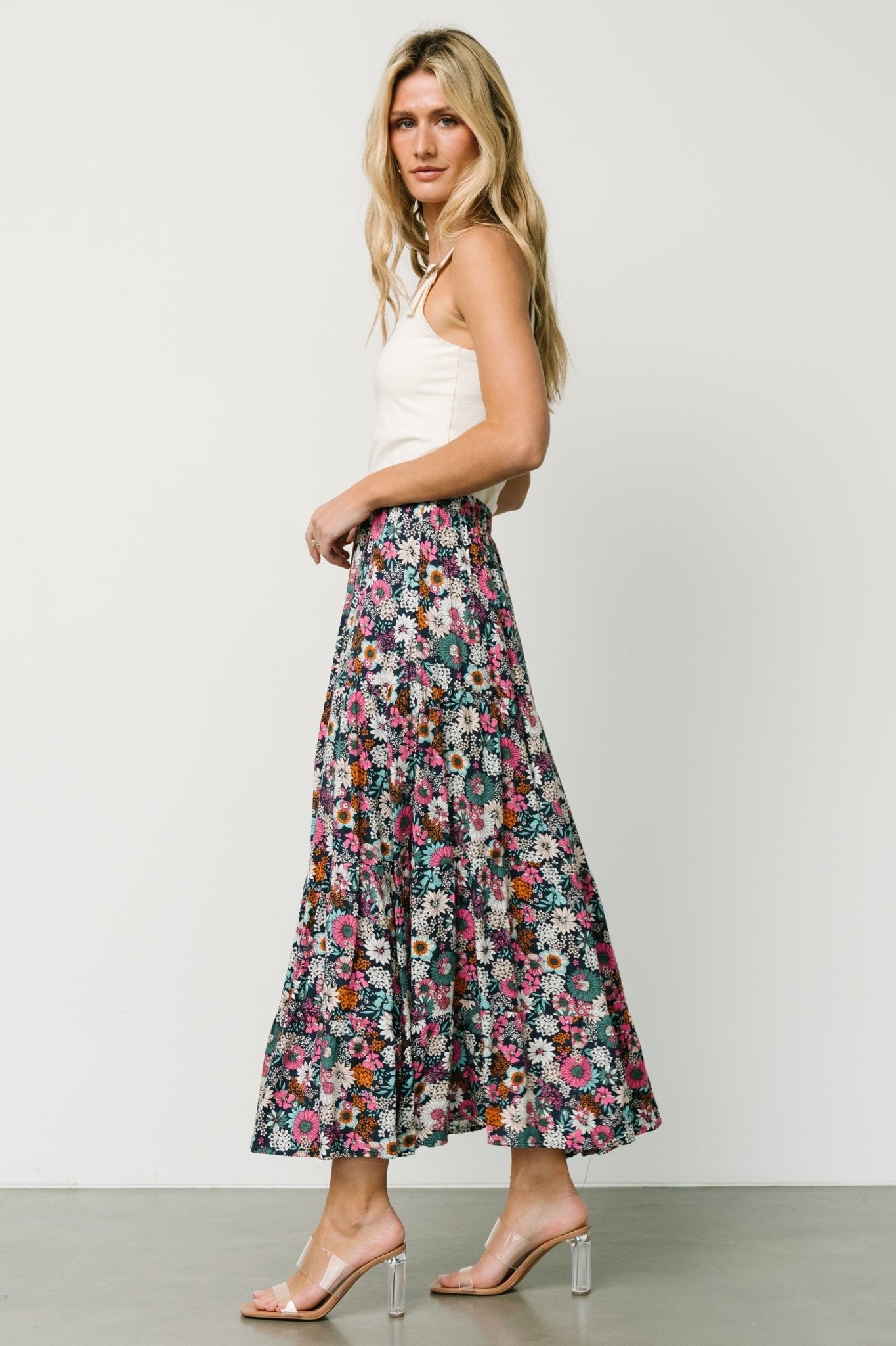 Flat lay showing the navy floral maxi skirt interior with partial lining and hem details, illustrating fabric and construction.