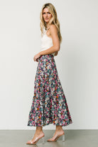 Flat lay showing the navy floral maxi skirt interior with partial lining and hem details, illustrating fabric and construction.