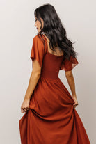 Close-up of sweetheart neckline and smocked back detail on Spice chiffon maxi dress, highlighting fabric texture and stitching
