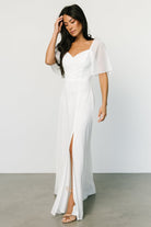 Detail view of the Sierra Sweetheart Maxi Dress in white, showing fabric texture, lining contrast, and delicate chiffon finish.