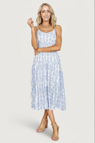 Three-quarter view showing adjustable tank straps, elastic at the back neck and the dress's textured blue-and-off-white rayon blend fabric.